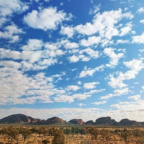 I can't decide which is more fascinating - Kata Tjuta, or the cotton-like clouds against the