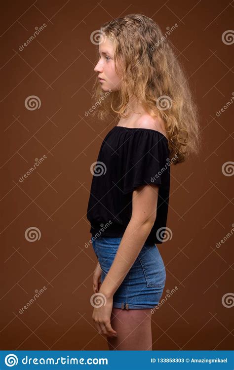 Profile View Portrait Of Young Beautiful Blonde Teenage