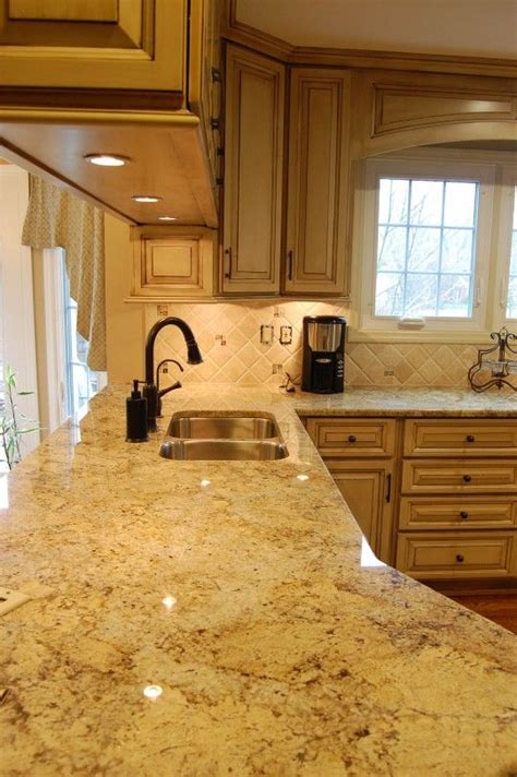 See quartz countertop colors, finishes, edges. The floor shown, against the light wood cabinets with a ...