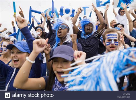 Enthusiastic Crowd In Blue Cheering At Sports Event Stock Photo Alamy