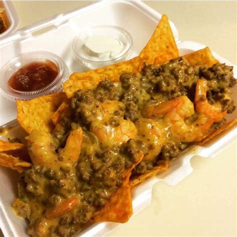 doritos nachos with ground beef shrimp cheese and a tangy dipping