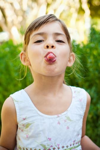 Girl Sticking Her Tongue Out Stock Photo Download Image Now Istock