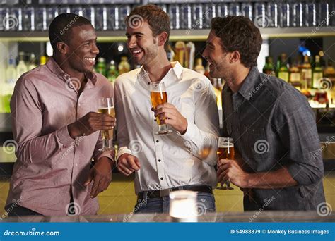 Three Male Friends Enjoying Drink At Bar Stock Image Image Of African Race 54988879