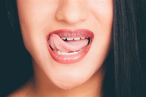 Woman With Wide Open Mouth And Tongue Out · Free Stock Photo