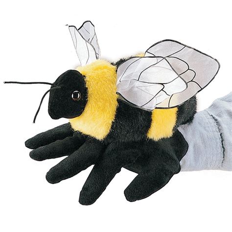 A Stuffed Bee Is Shown On A White Background
