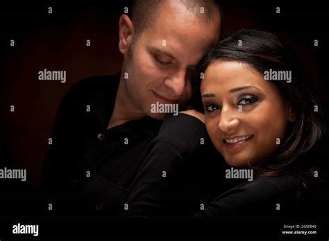 Happy Mixed Race Couple Flirting With Each Other Portrait Against A
