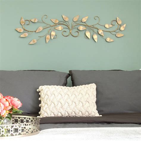 Stratton Home Decor Brushed Gold Over The Door Metal Scroll Wall Decor