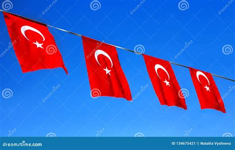 Four Turkish Flags Flying Against The Bright Blue Sky Stock Image