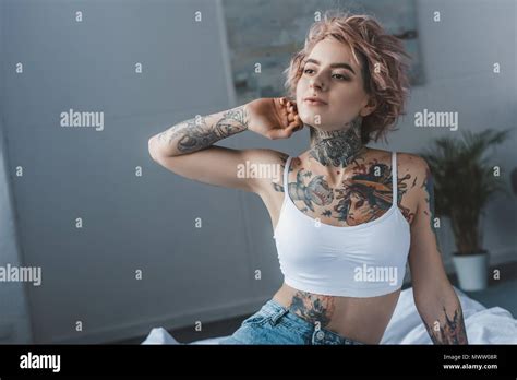 Beautiful Stylish Inked Girl Stretching In Bed At Morning Stock Photo