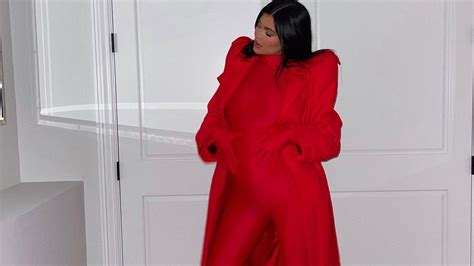 Sexy Baby Bump Update Kylie Jenner Poses In A Red Catsuit World
