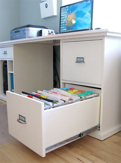 This sauder file cabinet unit features two spacious drawers with full extension slides that hold letter or legal size hanging files. Modest Maven: Custom Built Desk