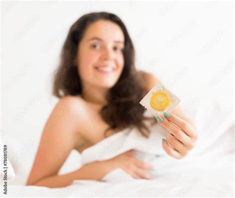Smiling Woman Holding Condom Stock Foto Adobe Stock