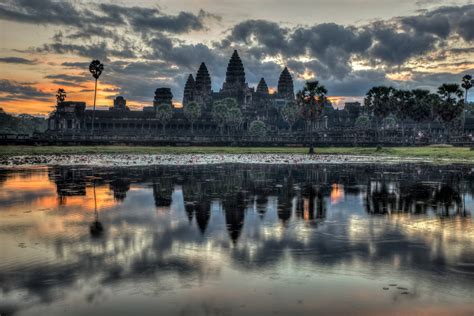 Angkor Wat Temple Reflected At Sunrise In Angkor Cambodia Think Orange