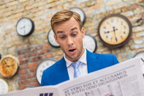 Businessman Reading Newspaper — Stock Photo © Iakovenko123 123128570