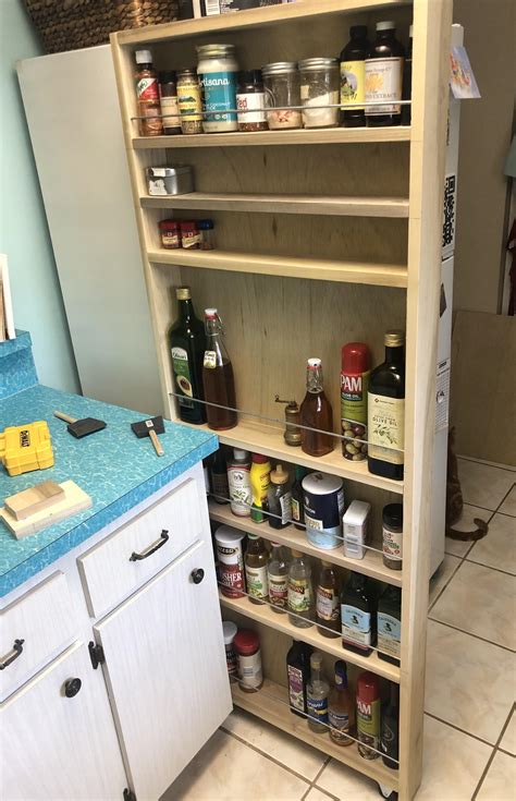 I just moved into a smaller condo and the pantry was too small. Needs paint but just finished my pull out pantry for next ...