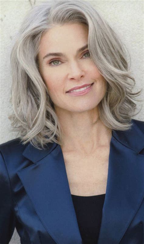 Long cascading haircut with full bangs. 80 Short Hairstyles For Women Over 50 To Look Elegant