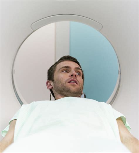A Young Man About To Have A Mri Scan Photograph By Ron Koeberer Fine