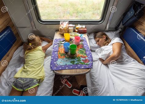 Mom And Two Daughters Fell Asleep In An Electric Train Car Stock Image