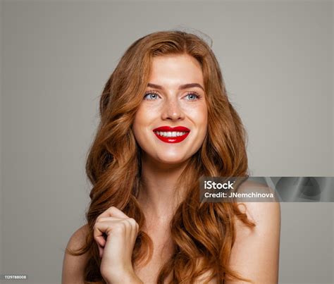 happy redhead woman smiling excited red head girl with curly hairstyle ginger hair cute smile