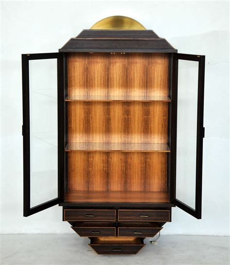 Gently used, vintage, and antique curio display cabinets. Exotic Rosewood and Brass Wall Hanging Curio Cabinet at ...