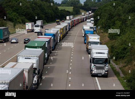Lorries Stand Queued Up Between Junctions 8 And 9 Of The M20 Motorway As Seen From The A20 Road