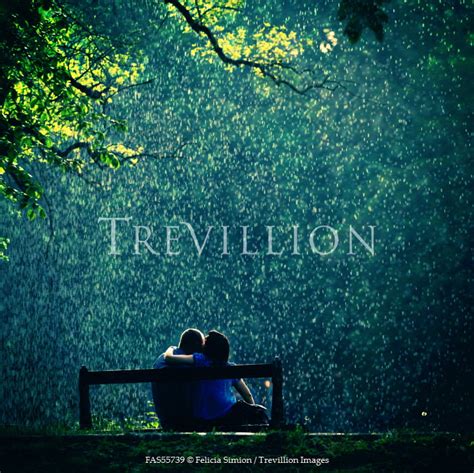 Trevillion Images Felicia Simion Couple Embracing On Bench In Rain Pe4