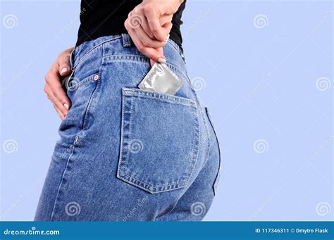 Woman Is Putting A Condom In Back Jeans Pocket Stock Image Image Of Body Faded