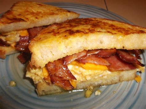 Breakfast Sandwich Bacon Cheese And Eggs On French Toast Eatsandwiches