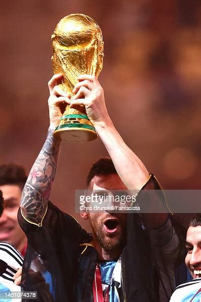 Lionel Messi Of Argentina Lifts The Fifa World Cup Trophy During The