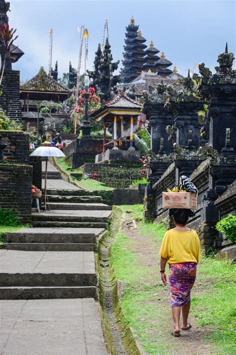 Balinese People Walk In Traditional Dress In Pura Besakih Editorial