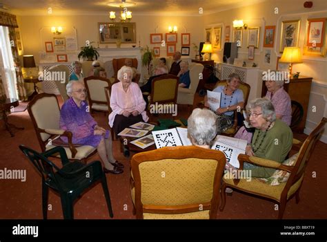 Group Of Elderly People In Communal Lounge Of Old Age Pensioners Home