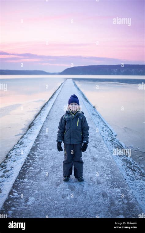 Sweden Vastergotland Lerum Portrait Of Boy 6 7 On Footbridge Stock