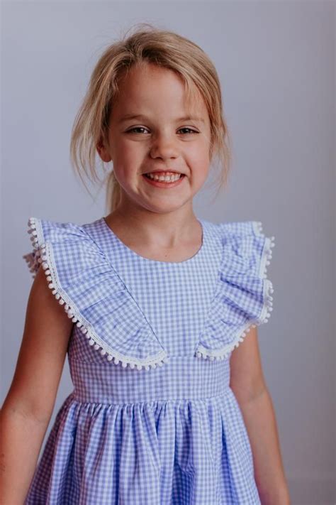 Little Girls Purple Gingham Ruffle Pinafore Dress With Pom Pom Trim In