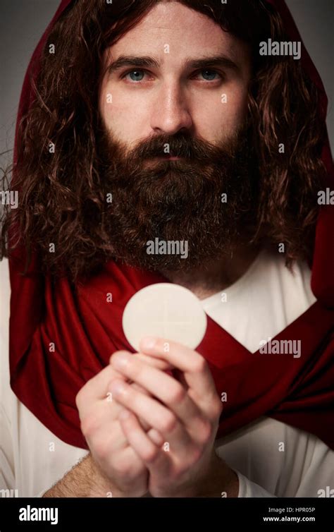 Jesus Christ Holding Holy Eucharist In Hands Stock Photo Alamy
