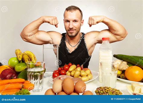 Fitness Young Man Presenting His Healthy Diet For Powerfull Body Stock