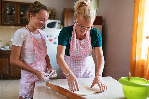 Mom Teaches Her Daughter How To Make A Dough By Stocksy Contributor Mihajlo Ckovric Stocksy