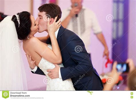 A Passionate Kiss Of Just Married Couple During Their First Dance Stock