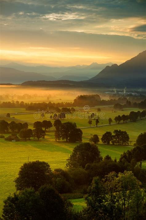 Breathtaking Morning Lansdcape Of Small Bavarian Village Covered In Fog