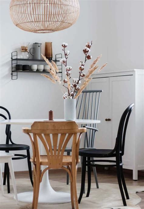 Whitewashed Kitchen With Mismatched Vintage Bentwood Dining Chairs