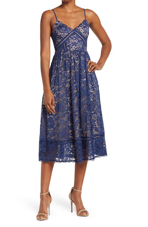 This Elegant And Feminine Midi Dress With Detailed Lace Overlay Has