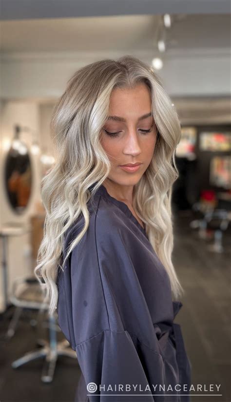 ashy balayage with bright blonde highlights around the face short platinum blonde hair summer