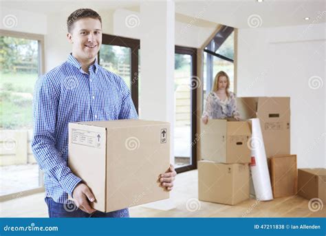 Young Couple Moving Into New Home Together Stock Photo Image Of Happy