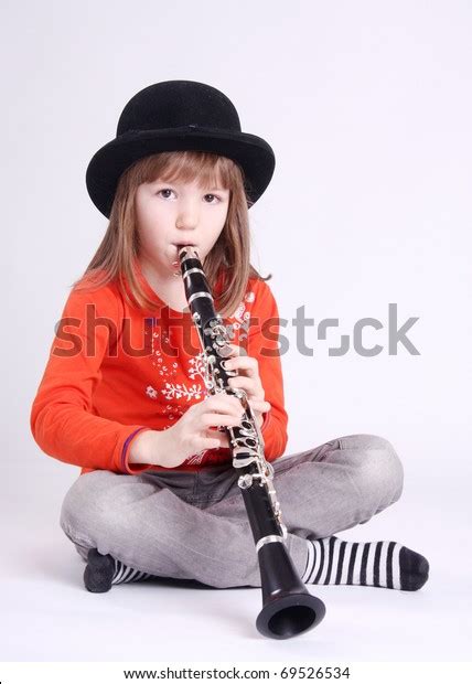Little Girl Playing On Clarinet Stock Photo Edit Now 69526534