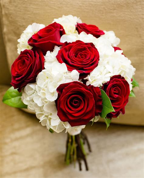 Roses and weddings go together like rainbows and good luck. Red roses and white hydrangeas. Classic bouquet for a fall ...