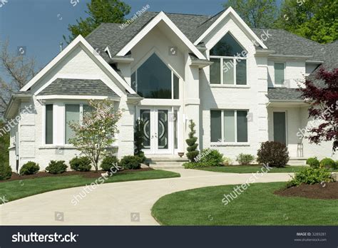 Beautiful White Brick Home Featuring A Modern