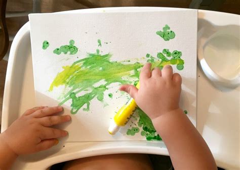 Easy Toddler Painting Project With Paint Sticks And Toys