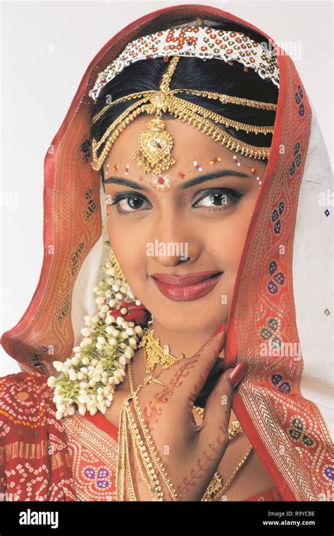 A Portrait Of A Gujarati Bride Dressed In Traditional Saree Called