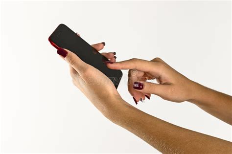 Hands Of A Young Woman Holding A Mobile Phone White Background Stock