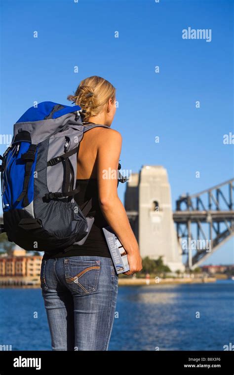 A Young Backpacker With Guidebook On Sydney Harbour Sydney New South