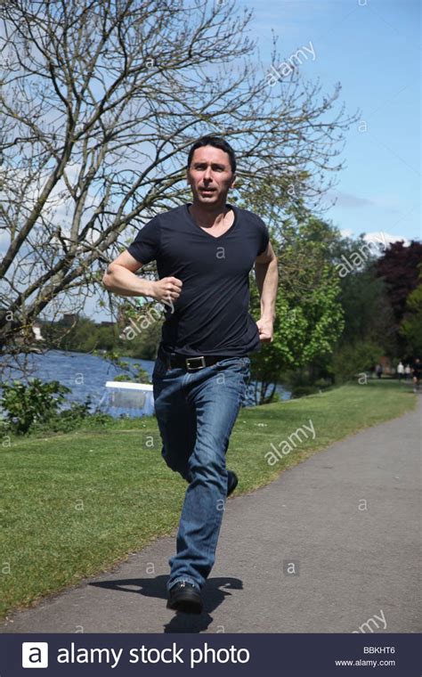 Man Running Towards The Camera Stock Photo Royalty Free Image